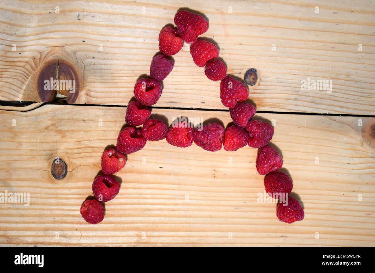 Raspberry Sign Letters Alphabetical letters made of raspberries on a white background Stock ...