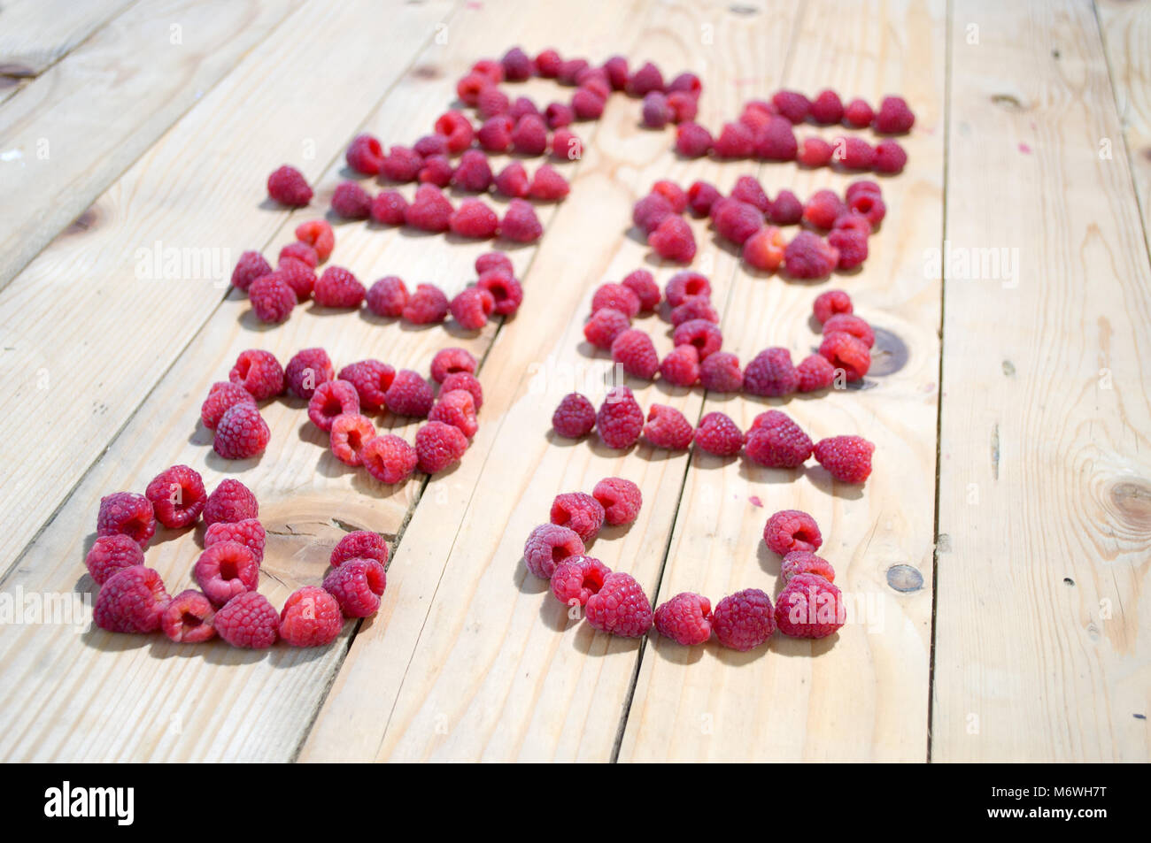 Written Eating clean, with raspberry Stock Photo - Alamy
