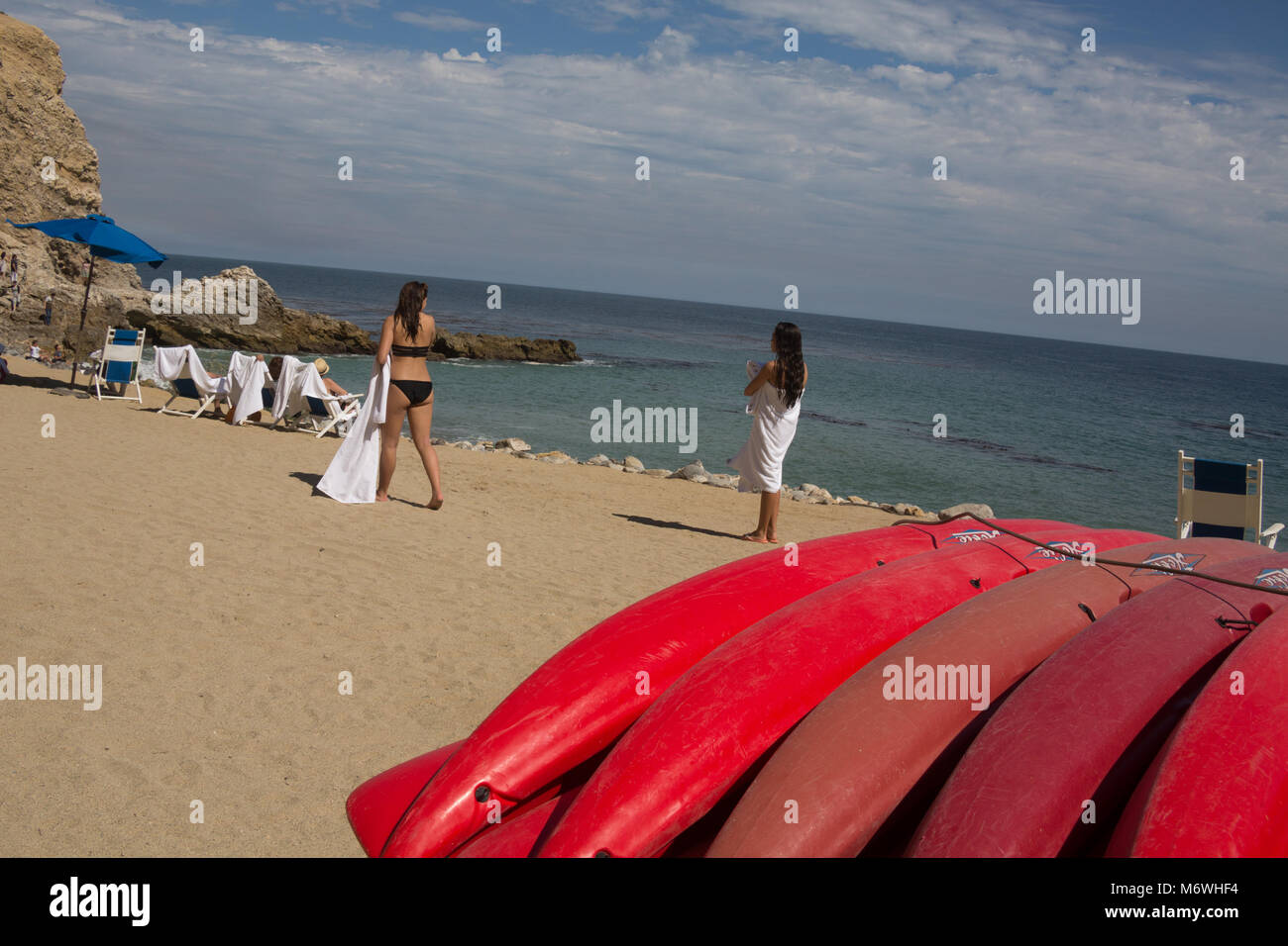 Red Kayaks And Two Women On The Beach At Terranea Resort In