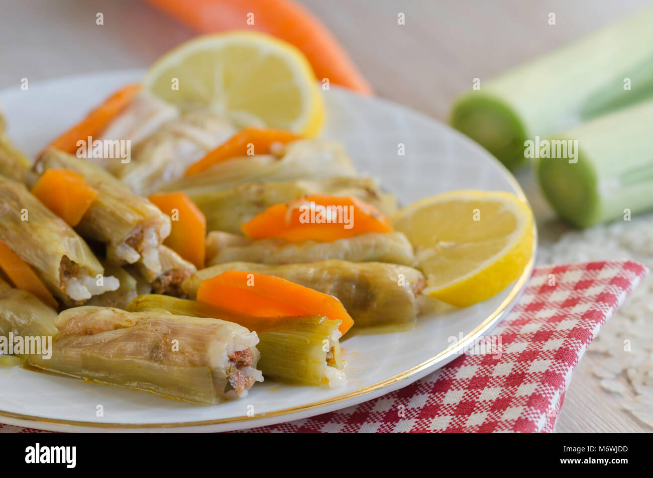 Leek Wrapped Traditional leek wrap with meat and rice on the whitw plate Stock Photo ...