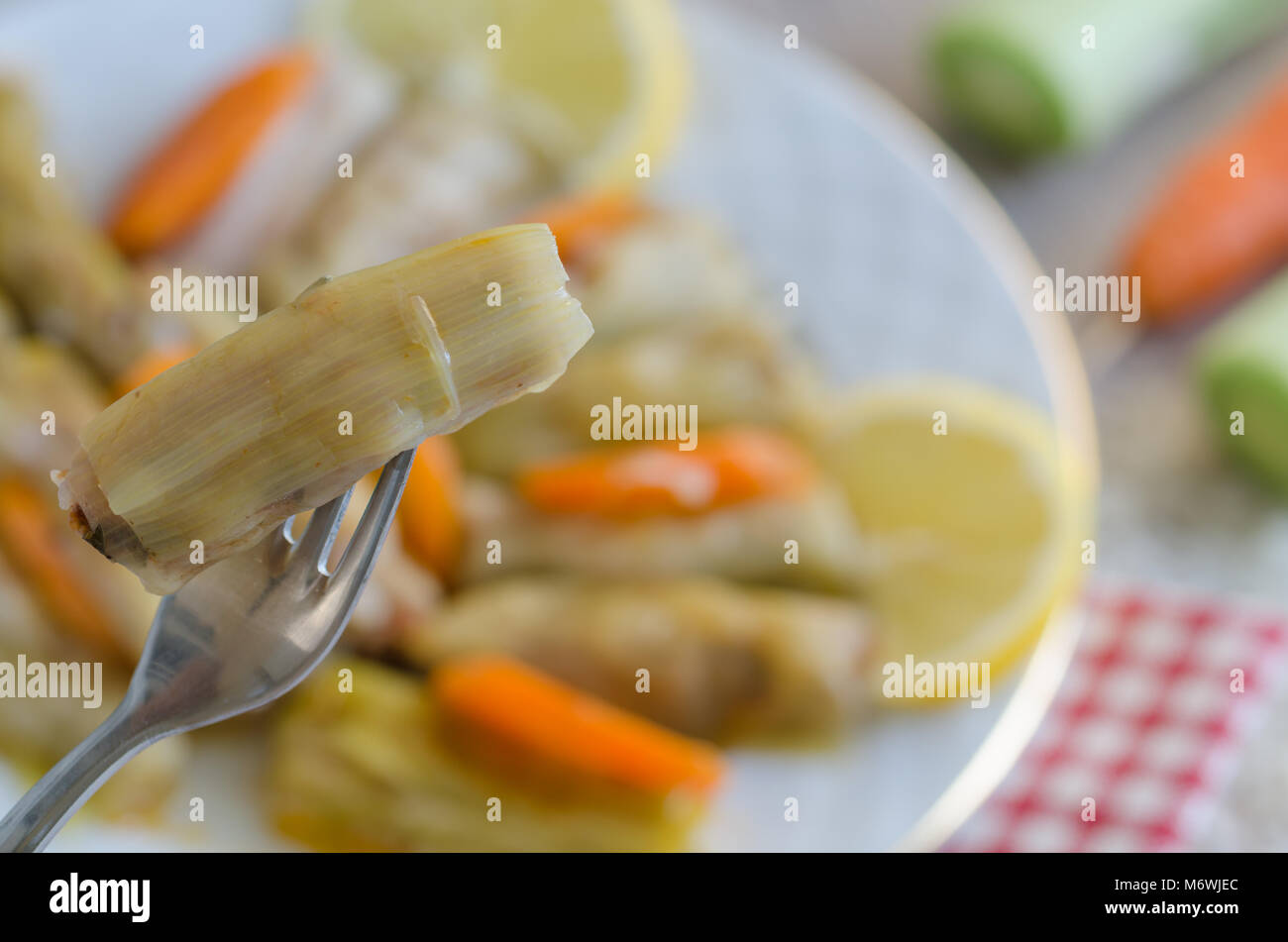 Leek Wrapped Traditional leek wrap with meat and rice on the whitw plate Stock Photo ...
