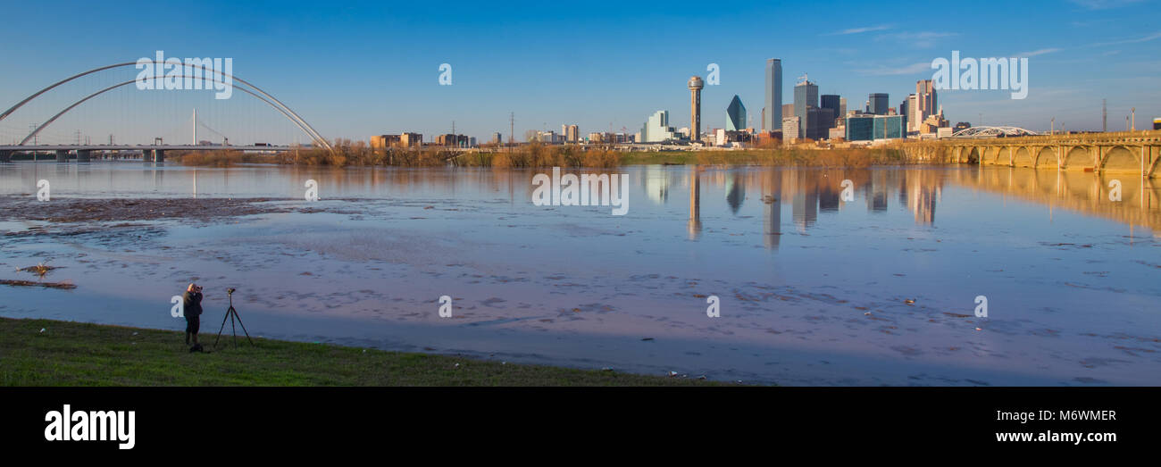 This is the picture of a photographer taking picture of Dallas skyline ...