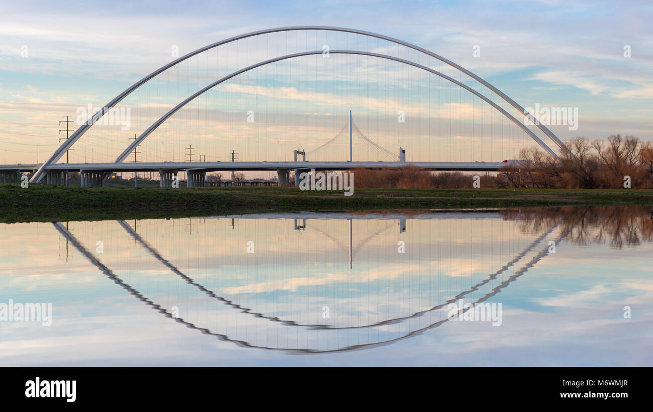 This is the picture of Reflection of Margaret Hunt Hill Bridge and Margaret McDermott Bridge during Day time from Trinity River, Dallas, Texas. Stock Photo