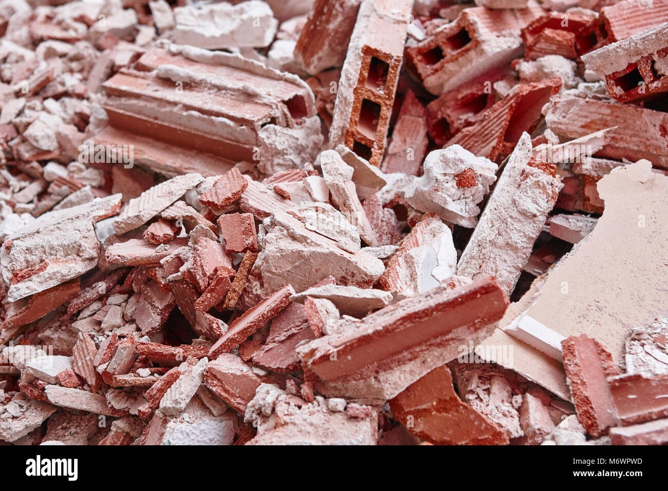 Removal of debris. Construction waste. Building demolition. Devastation background Stock Photo