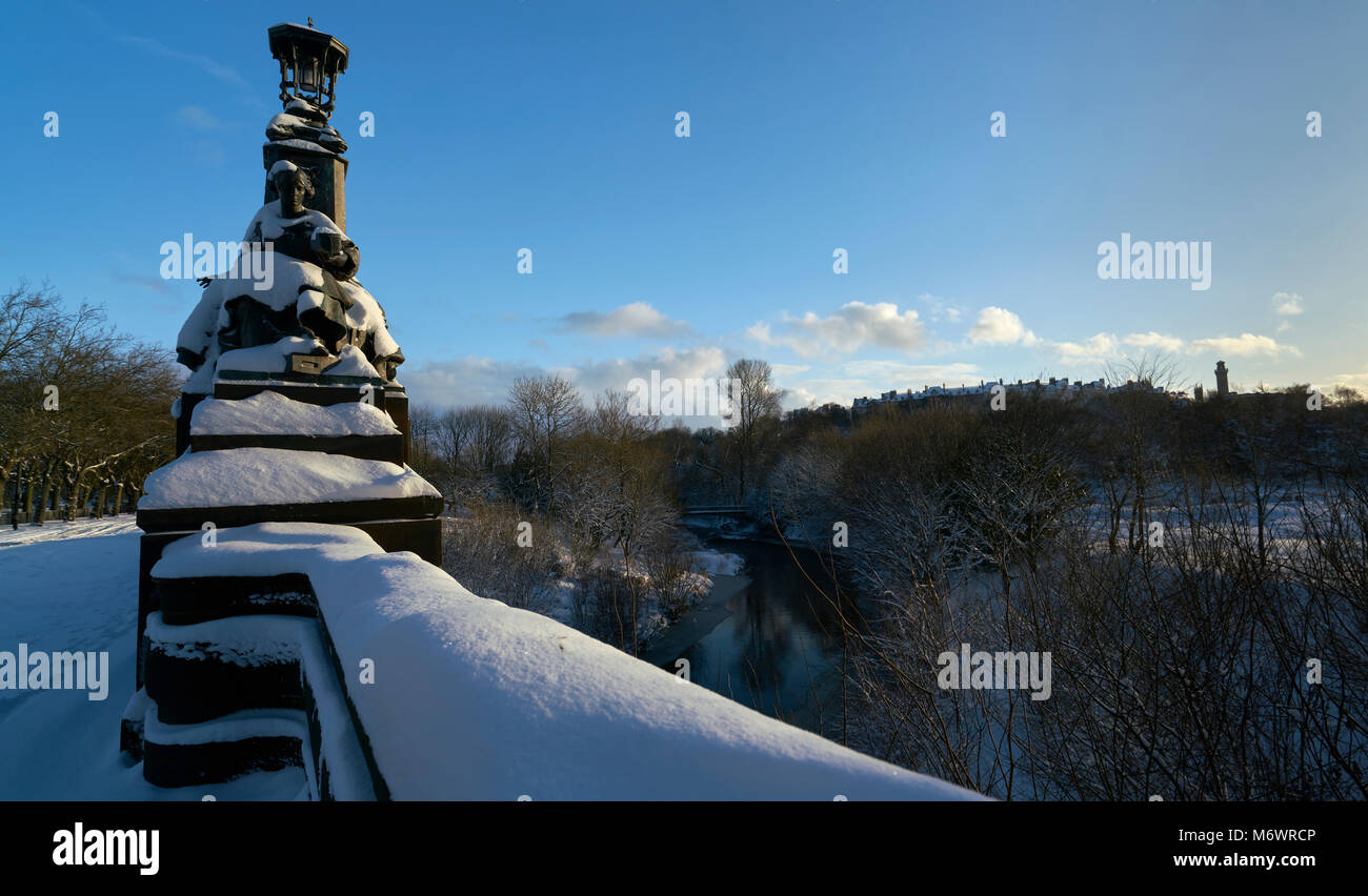 Bronze statues on Kelvin Way Bridge Glasgow covered in snow after heavy snow storm Stock Photo