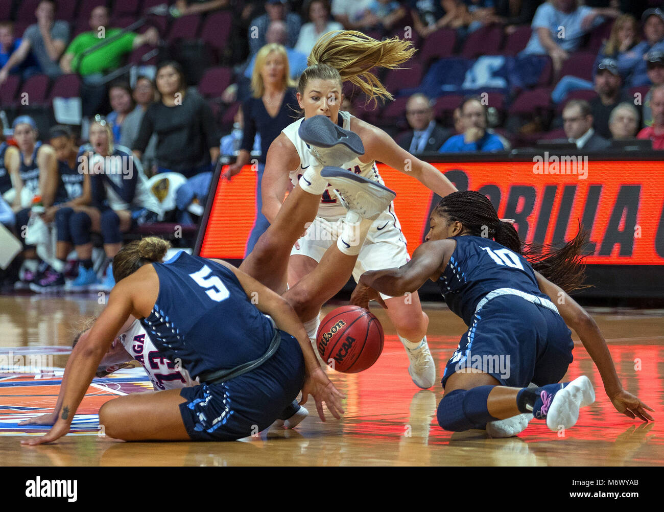 Las Vegas, Nevada, USA. 31st Jan, 2018. Gonzaga Bulldogs forward Jill Barta (13) tumbles after a loose ball between San Diego Toreros guard Aubrey Ward-El (5) and guard Myah Pace (10) during the final period of an NCAA college basketball game in the women's finals of the West Coast Conference tournament, Tuesday, March 6, 2018, in Las Vegas.Photo by L.E. Baskow Credit: L.E. Baskow/ZUMA Wire/Alamy Live News Stock Photo