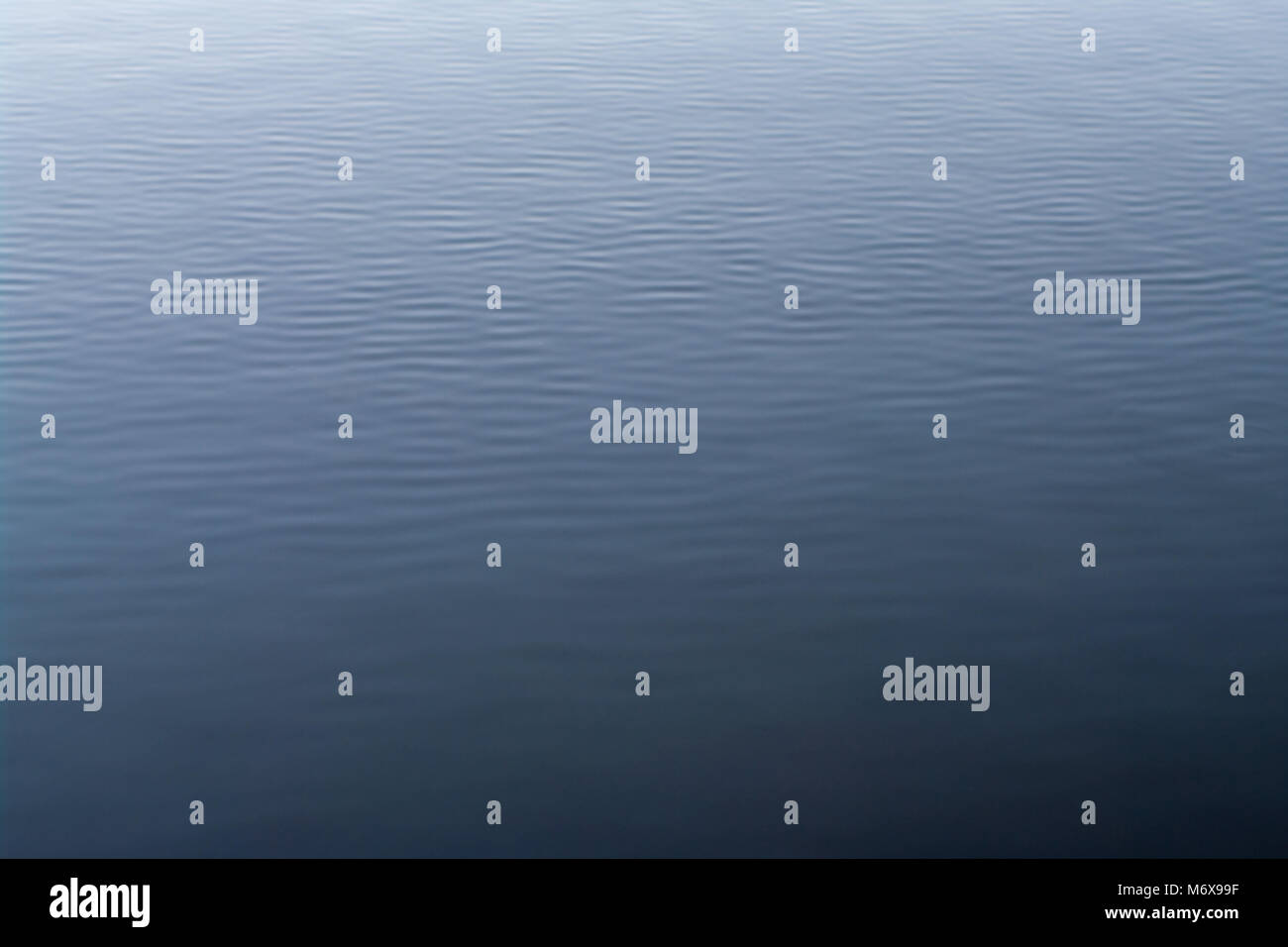 background of blue water surface with waves Stock Photo - Alamy
