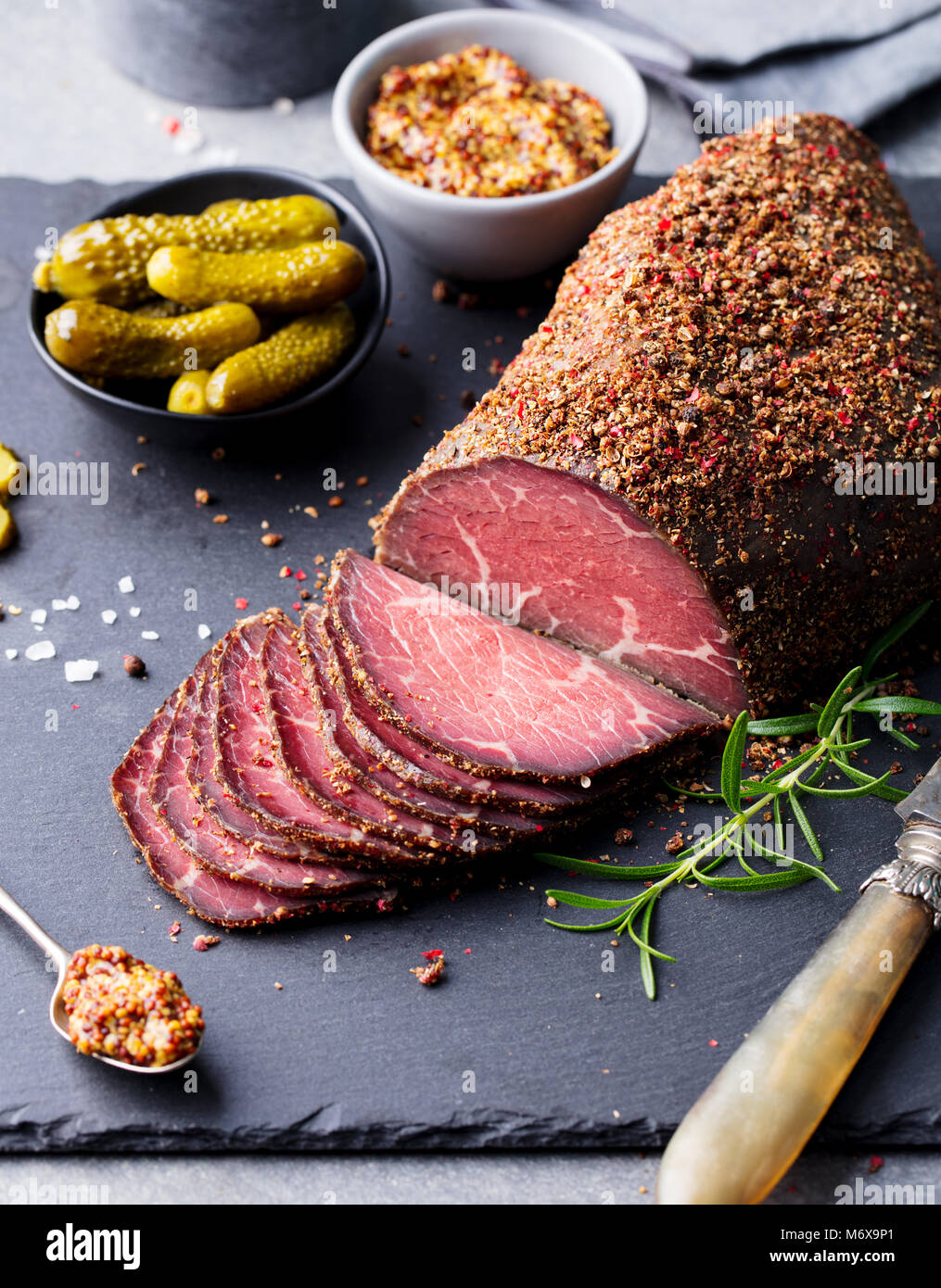 Roasted beef, pastrami on slate board. Close up Stock Photo Alamy