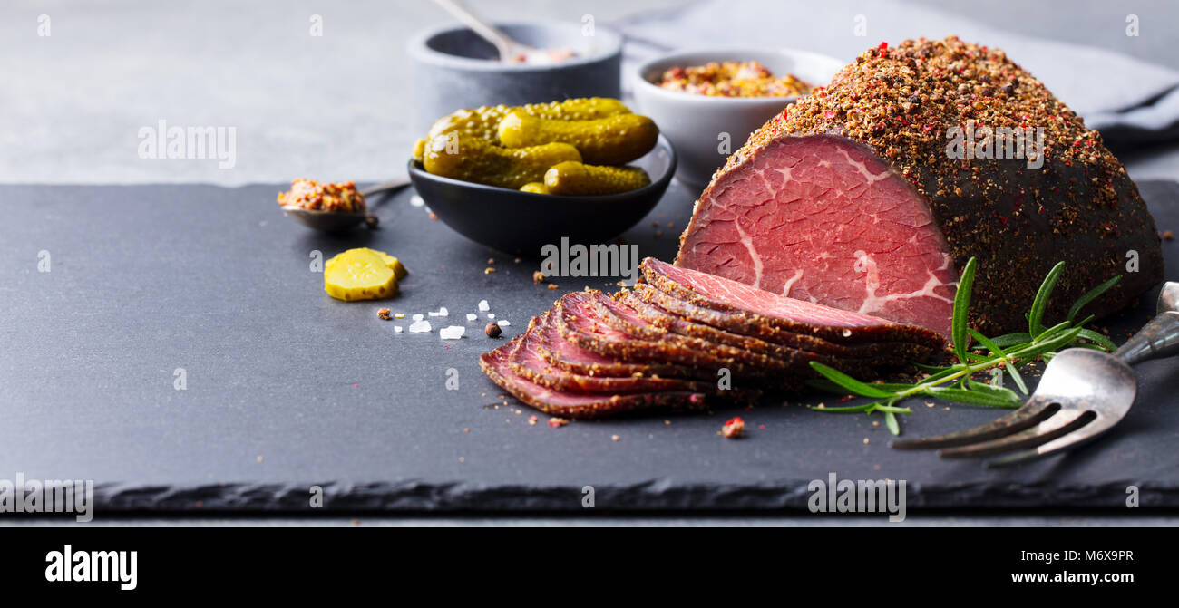 Roasted beef, pastrami on slate board. Copy space Stock Photo Alamy
