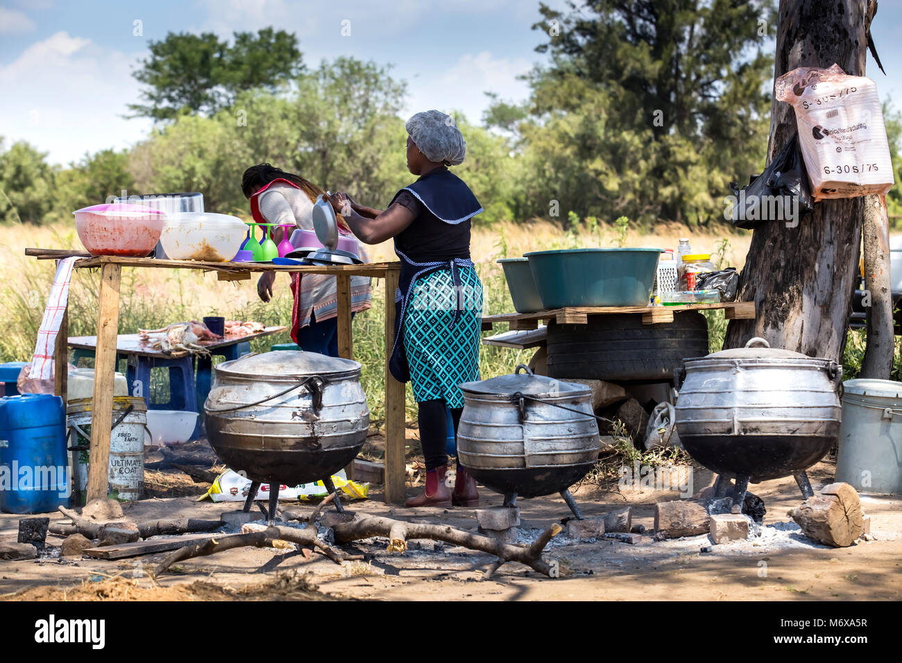 Roadside food stall with large cooking pots. Stock Photo