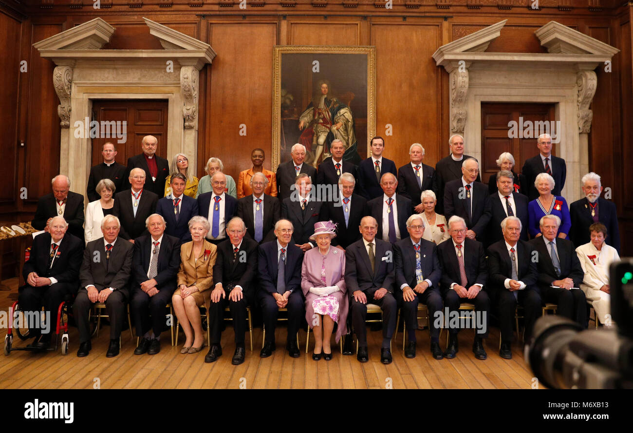 Photo Must Be Credited ©Alpha Press 073074 13/06/2017  Britain's Queen Elizabeth II (front C) sits next to Britain's Prince Philip, Duke of Edinburgh (front CR) during an official photograph with Companions of Honour after a reception in celebration of the centenary of the Order of the Companions of Honour at Hampton Court Palace, in Richmond upon Thames, in southwest London. (top row L-R) Reverend Anthony Howe, Reverend Richard Chartres, Evelyn Glennie, Baroness Warnock, Baroness Amos, Harry Woolf, Robert Smith, Baron Smith of Kelvin, George Osborne, Richard Eyre, reverend Paul Wright, Onora  Stock Photo