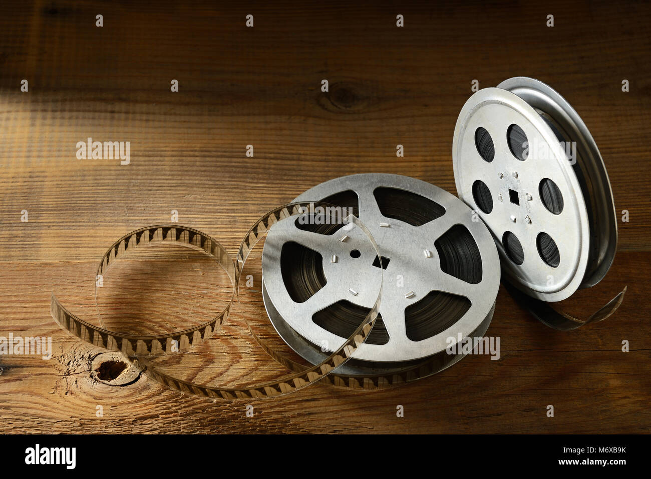 Old film strip on wooden background. Top view. Copy space for text Stock Photo