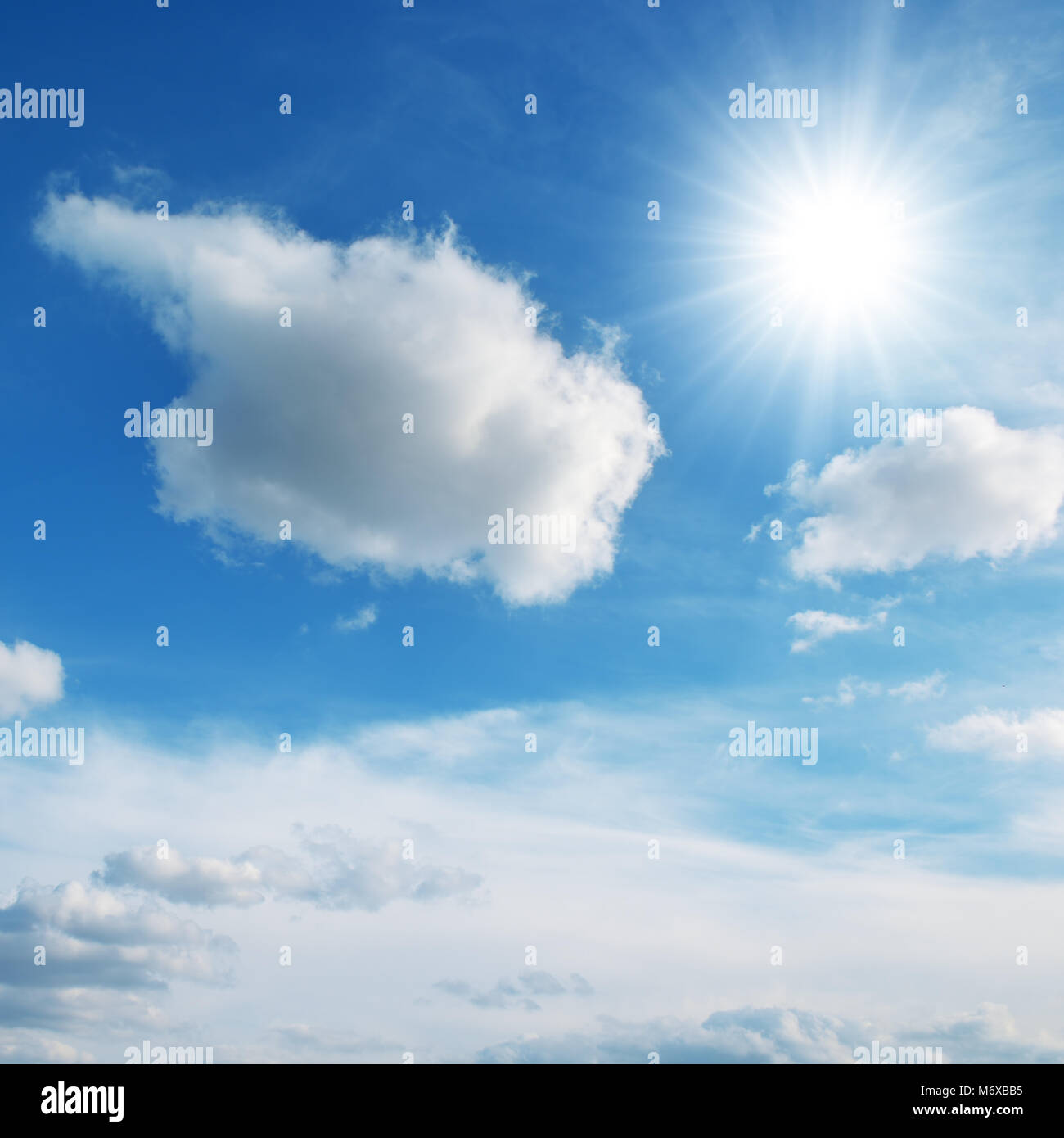 sun on blue sky and clouds Stock Photo
