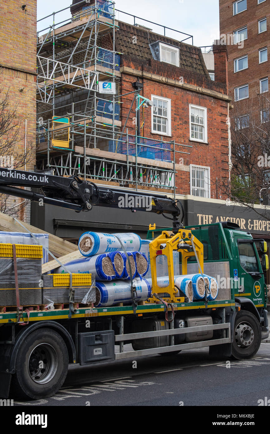 a construction or builders merchants delivery lorry at a building site