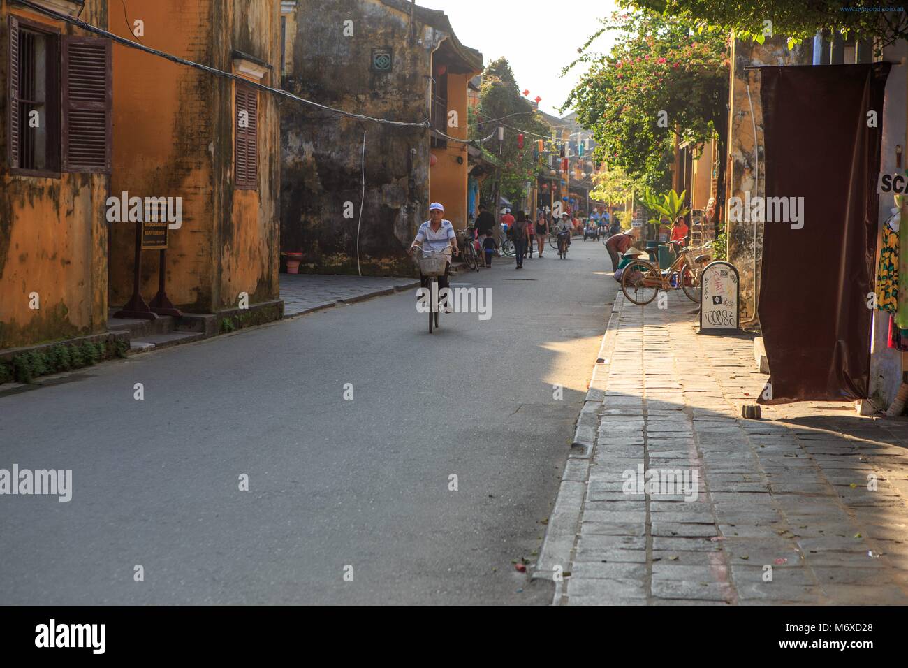 The streets of the old town of Hoi An are closed off to all but pedestrians and bicycles. Stock Photo