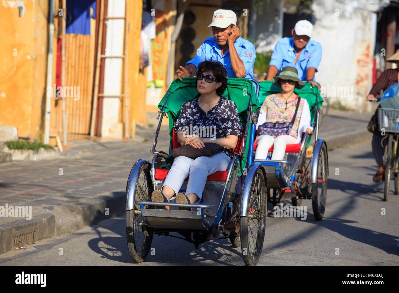 Tricycle rickshaws are a popular way for tourists to travel through the