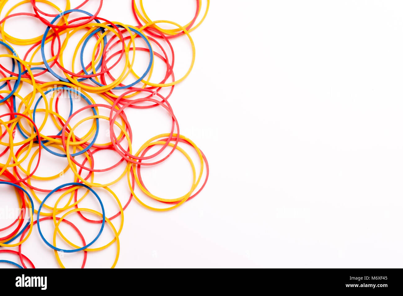 Rubber Bands arranged on white background Stock Photo - Alamy