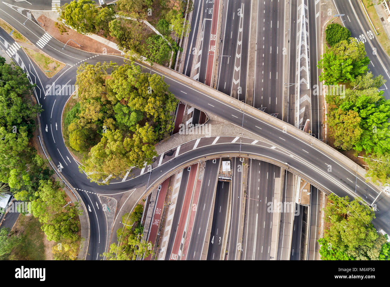 Warringah freeway at multi-level intersection of North Sydney when crossing street forms round about and a bridge at times with no traffic. Aerial vie Stock Photo