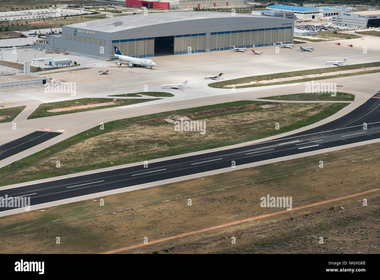 Aerial view on Athens airport runway, taxiways and apron with Olympic airways hangar Stock Photo