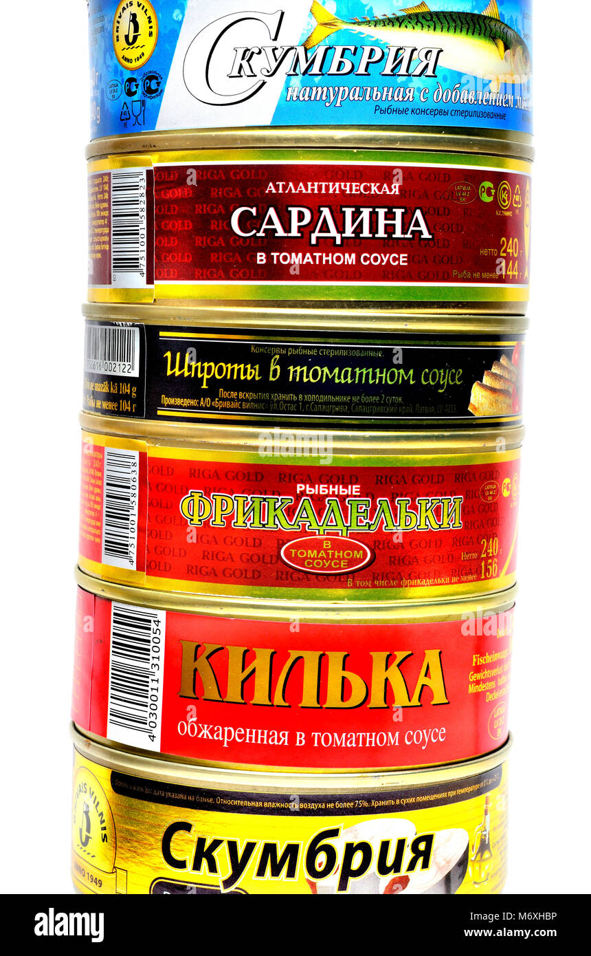 Canned fish from Eastern Europe with labels in Cyrilic script. From top: mackerel, sardines, sprats, fish balls in tomato sauce, sprats, mackerel. Stock Photo