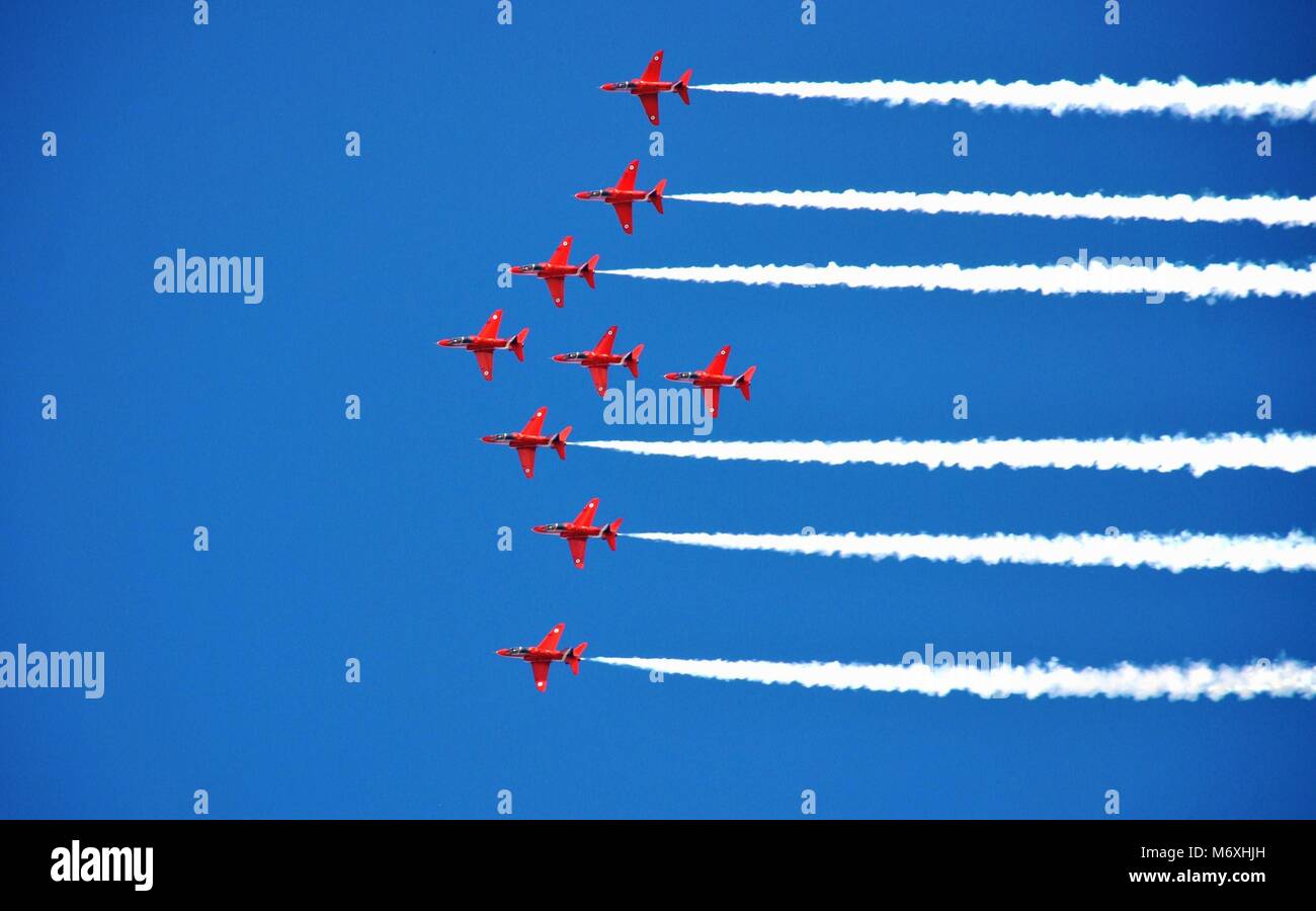 Royal Air Force aerobatic display team The Red Arrows perform at the Airbourne airshow at Eastbourne in East Sussex, England on August 14, 2010. Stock Photo