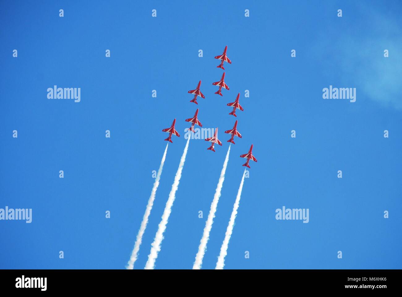 Royal Air Force aerobatic display team The Red Arrows perform at the Airbourne airshow at Eastbourne in East Sussex, England on August 14, 2010. Stock Photo
