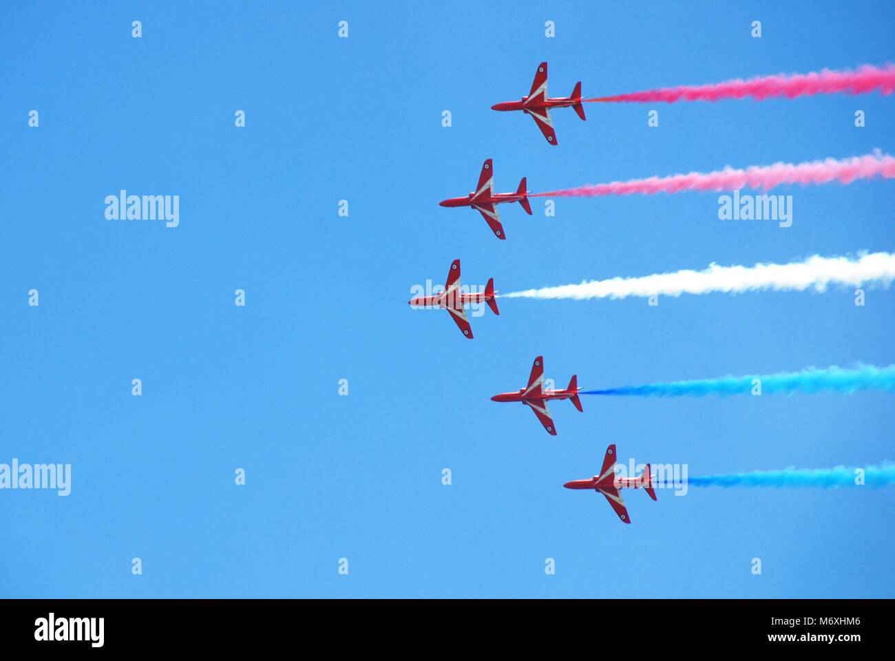 Royal Air Force aerobatic display team The Red Arrows perform at the Airbourne airshow at Eastbourne in East Sussex, England on August 14, 2010. Stock Photo