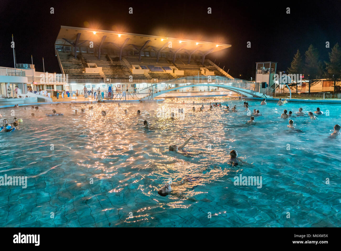 People enjoying the swimming pool, Reykjavik, Iceland Stock Photo