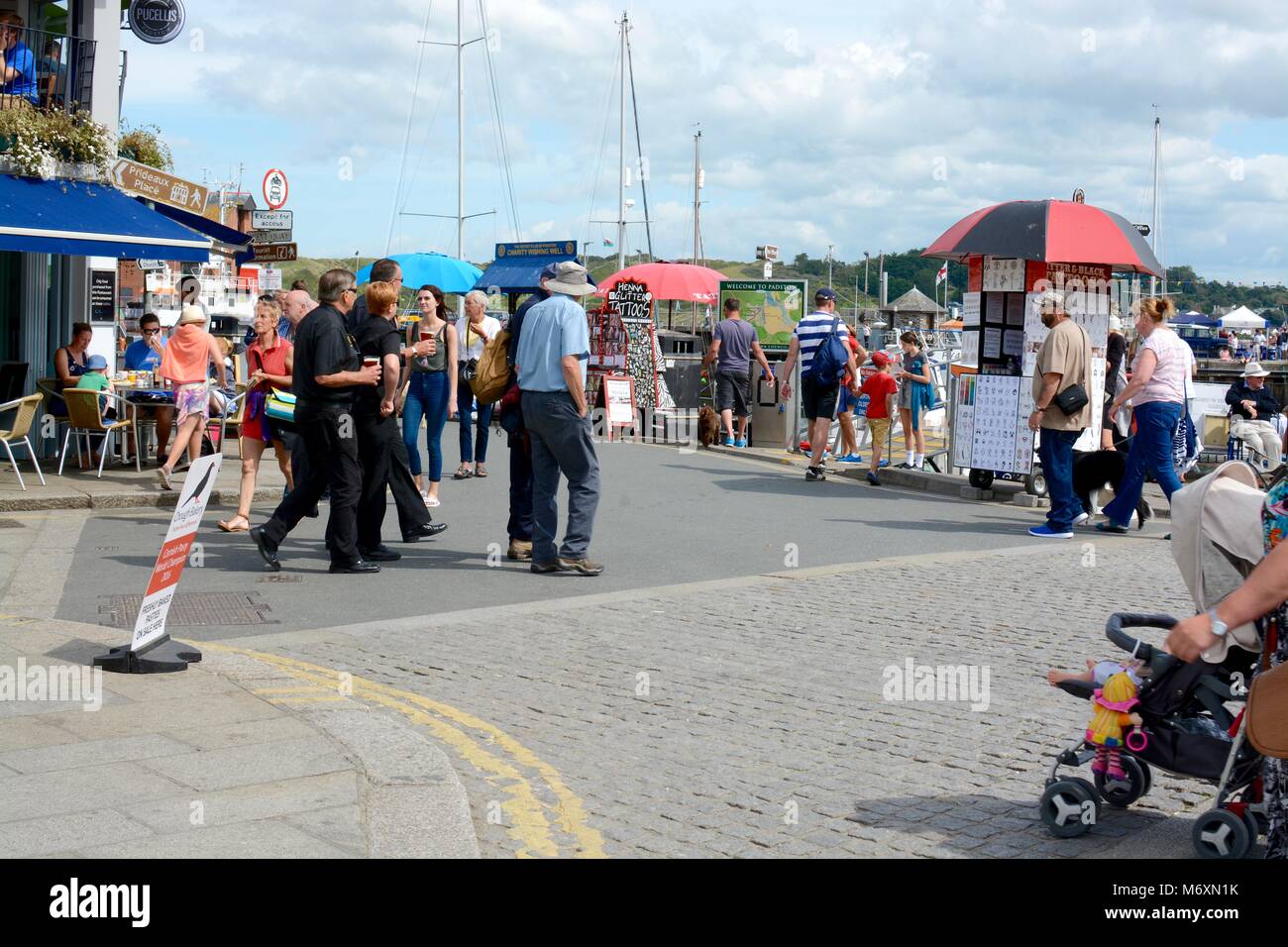 People on their holidays and visiting the town of Padstow, Cornwall, England, UK Stock Photo
