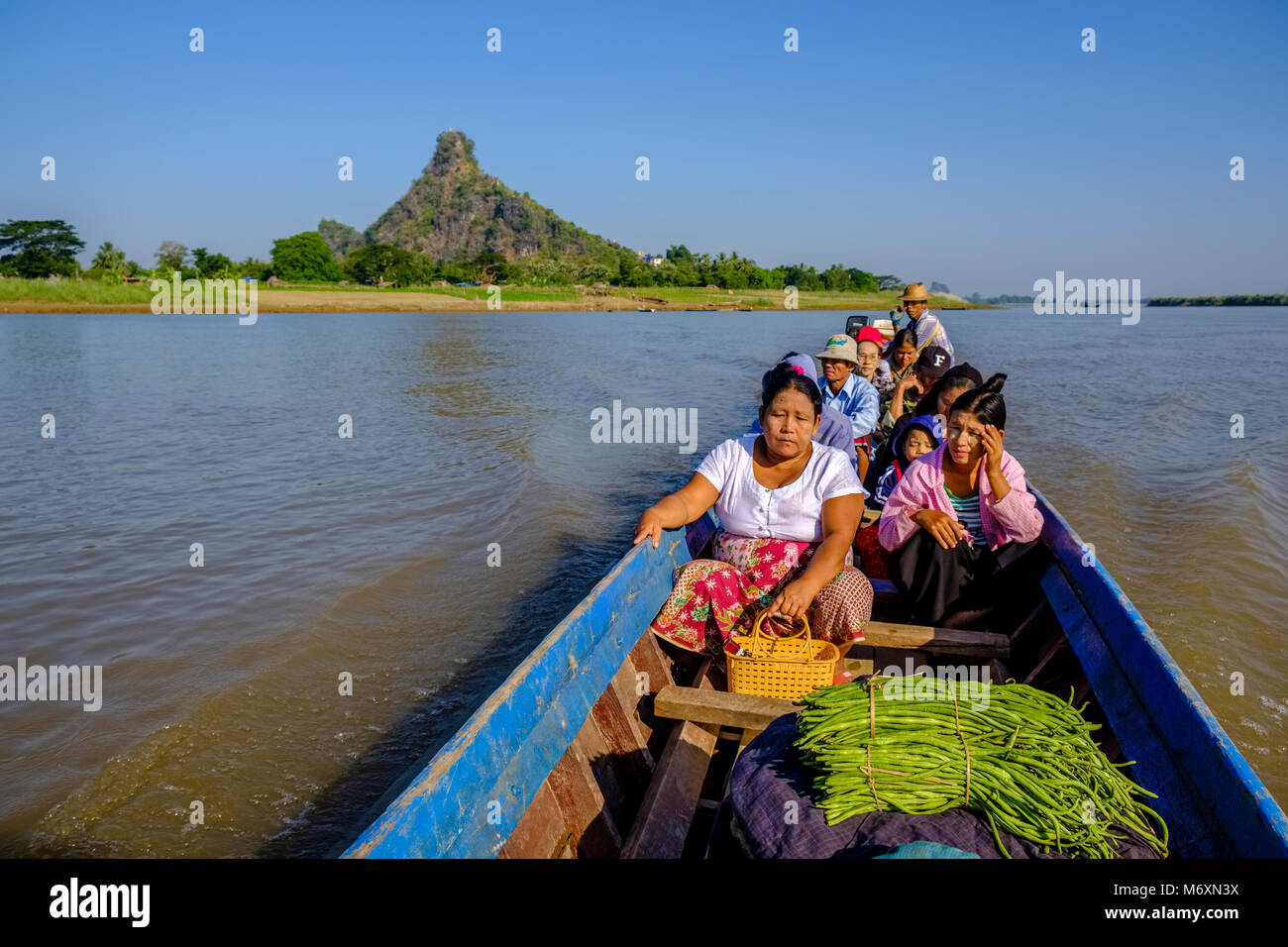 Local people from Hpa-Pu village are crossing Saluen Thanlyin river by boat Stock Photo