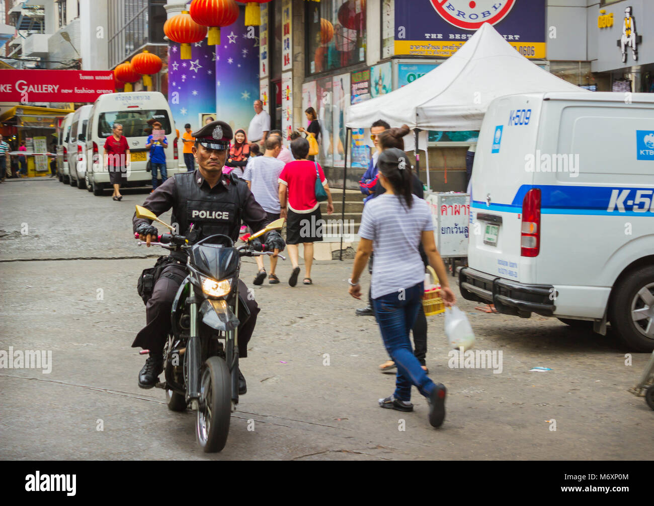 THAILAND, BANGKOK - FEB 20: Policeman riding a motorbike  in the Thai capital February 20, 2015 in Bangkok, Thailand. For convenience patrols in the c Stock Photo