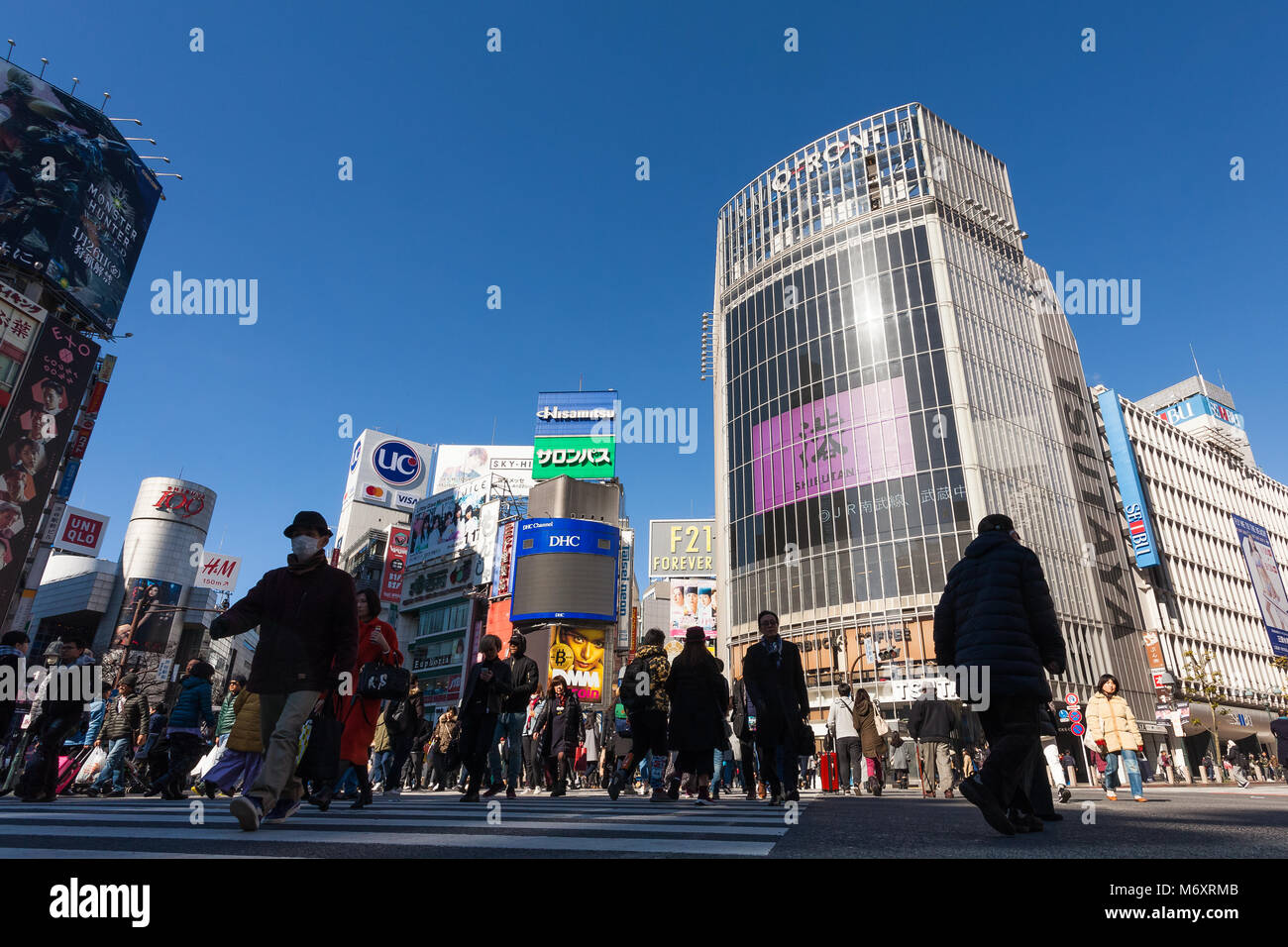 People cross the famous scramble crossing in Shibuya, Tokyo, Japan. Stock Photo