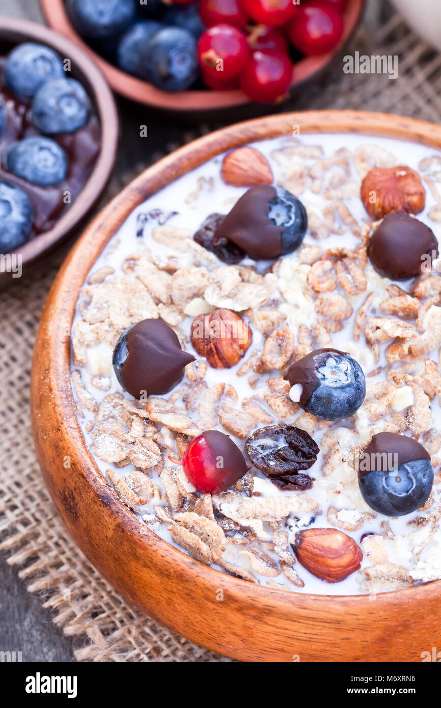 Healthy breakfast with muesli and chocolate covered berries Stock Photo