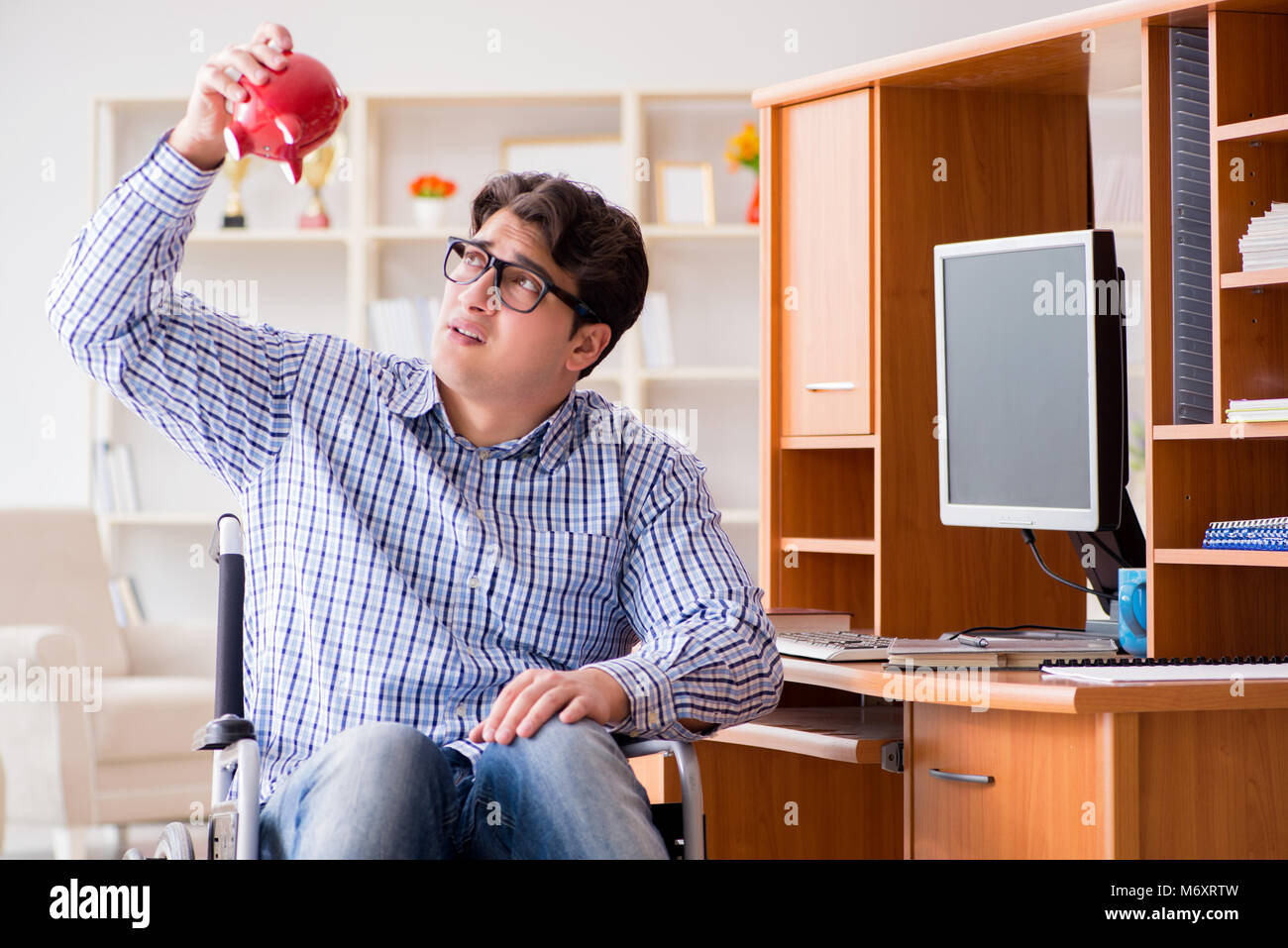 Disabled student studying at home on wheelchair Stock Photo - Alamy