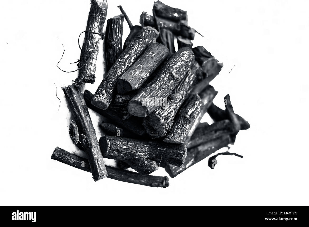 Close up of Ayurvedic herb Liquorice root,Licorice root, Mulethi or Glycyrrhiza glabra root isolated on white is very much beneficial for Soothes your Stock Photo