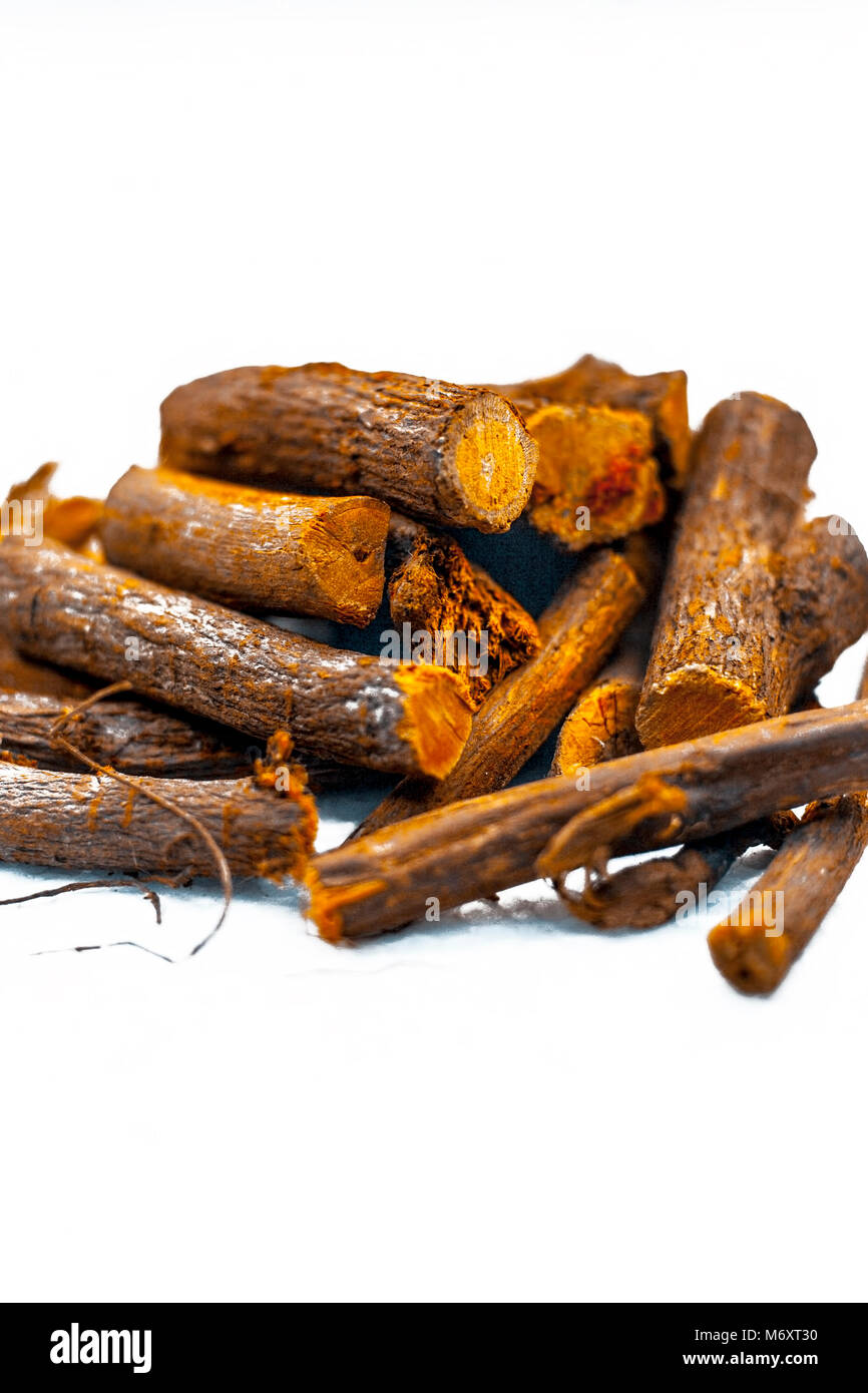 Close up of Ayurvedic herb Liquorice root,Licorice root, Mulethi or Glycyrrhiza glabra root isolated on white is very much beneficial for Soothes your Stock Photo