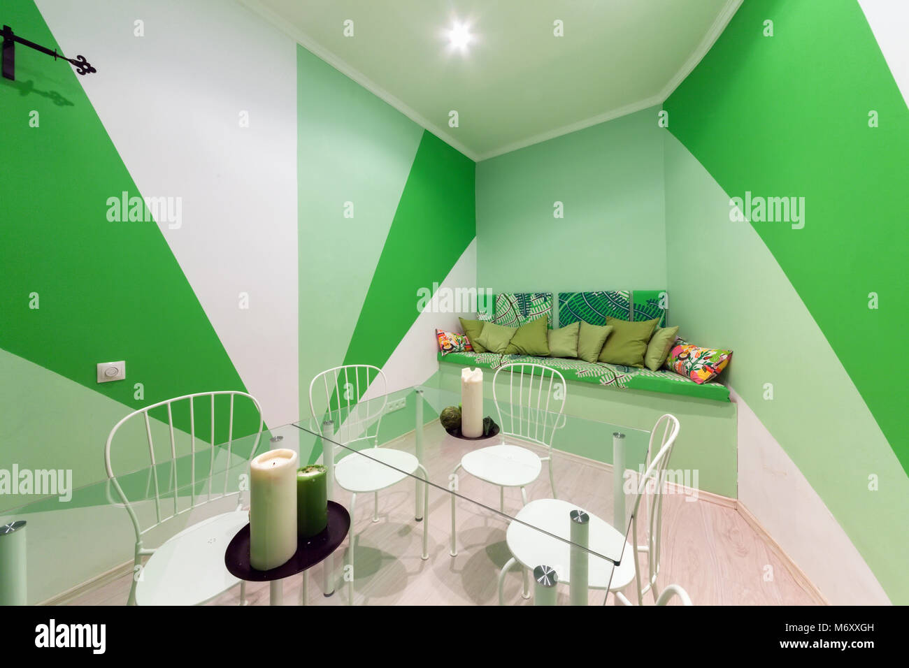MOSCOW - JULY 2014: Interior of the hookah and anticafe 'MELLOW-YELLOW'. Green room with sofa and glass table Stock Photo