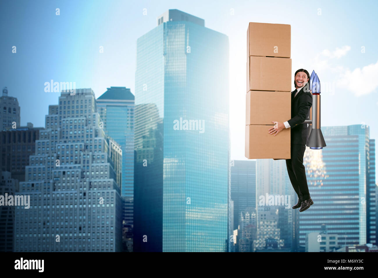 Businessman with jetpack delivering boxes globally Stock Photo - Alamy