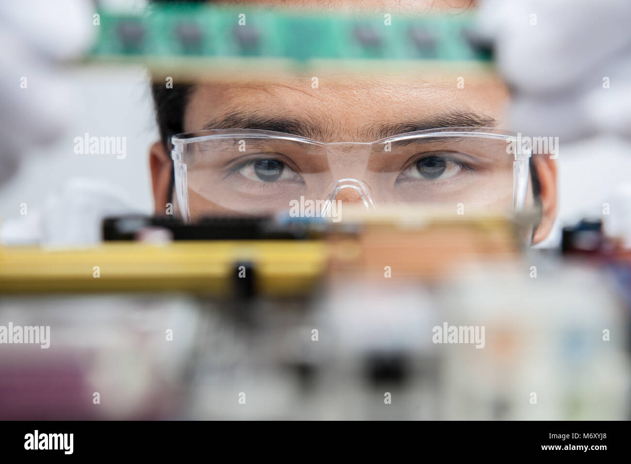 Expert engineers examining computer equipment Stock Photo - Alamy