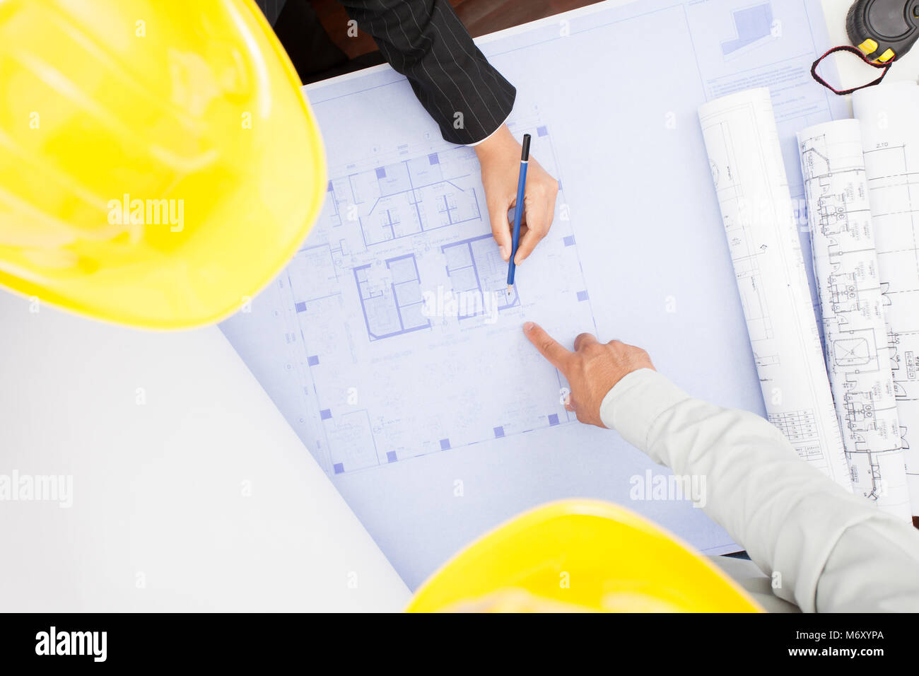 Architect sketching a construction project. Stock Photo