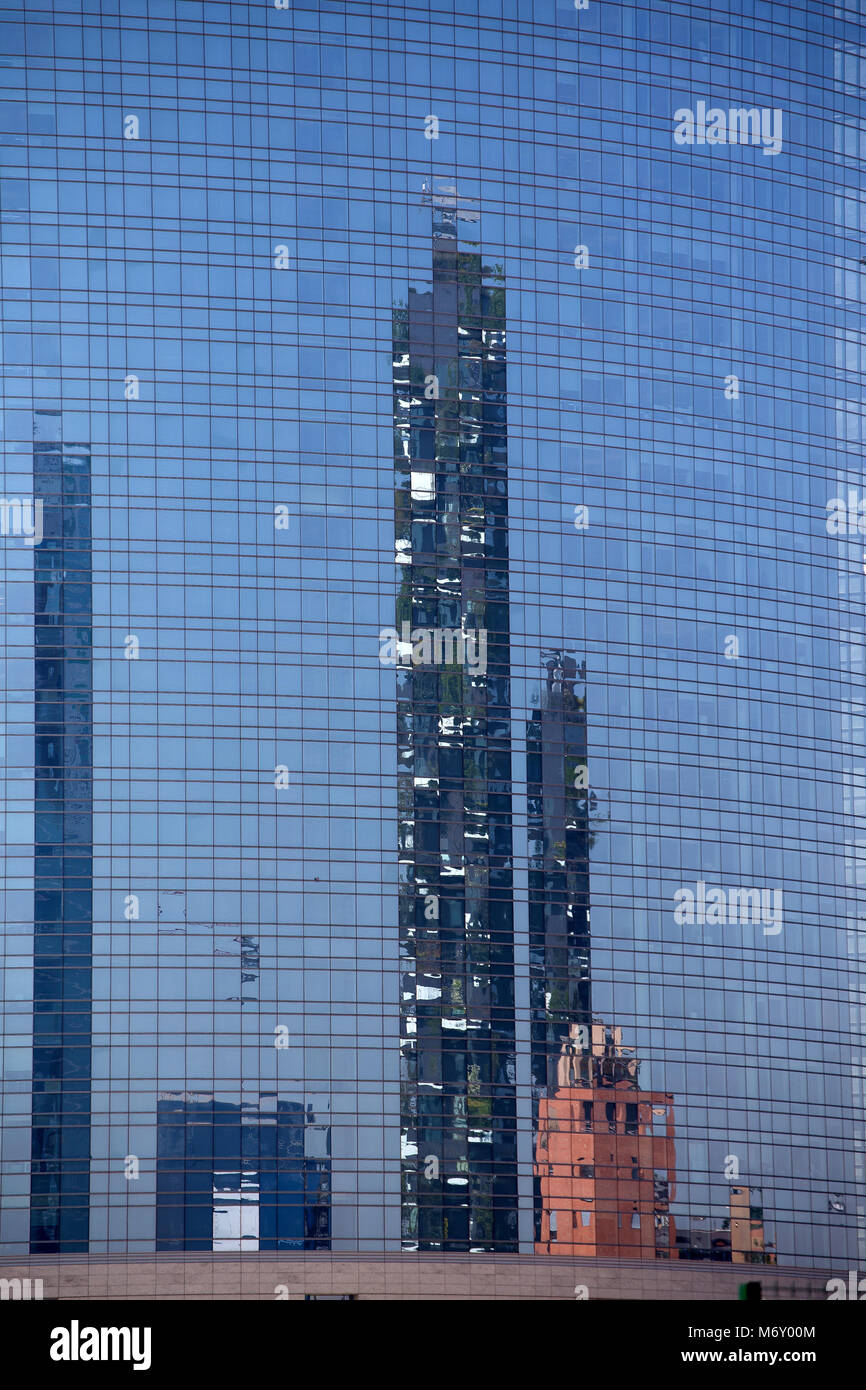 MILAN, ITALY, MARCH 28, 2017 -  'Bosco Verticale', vertical forest apartment and  buildings reflected in 'Unicredit Tower, buisness area near Garibald Stock Photo