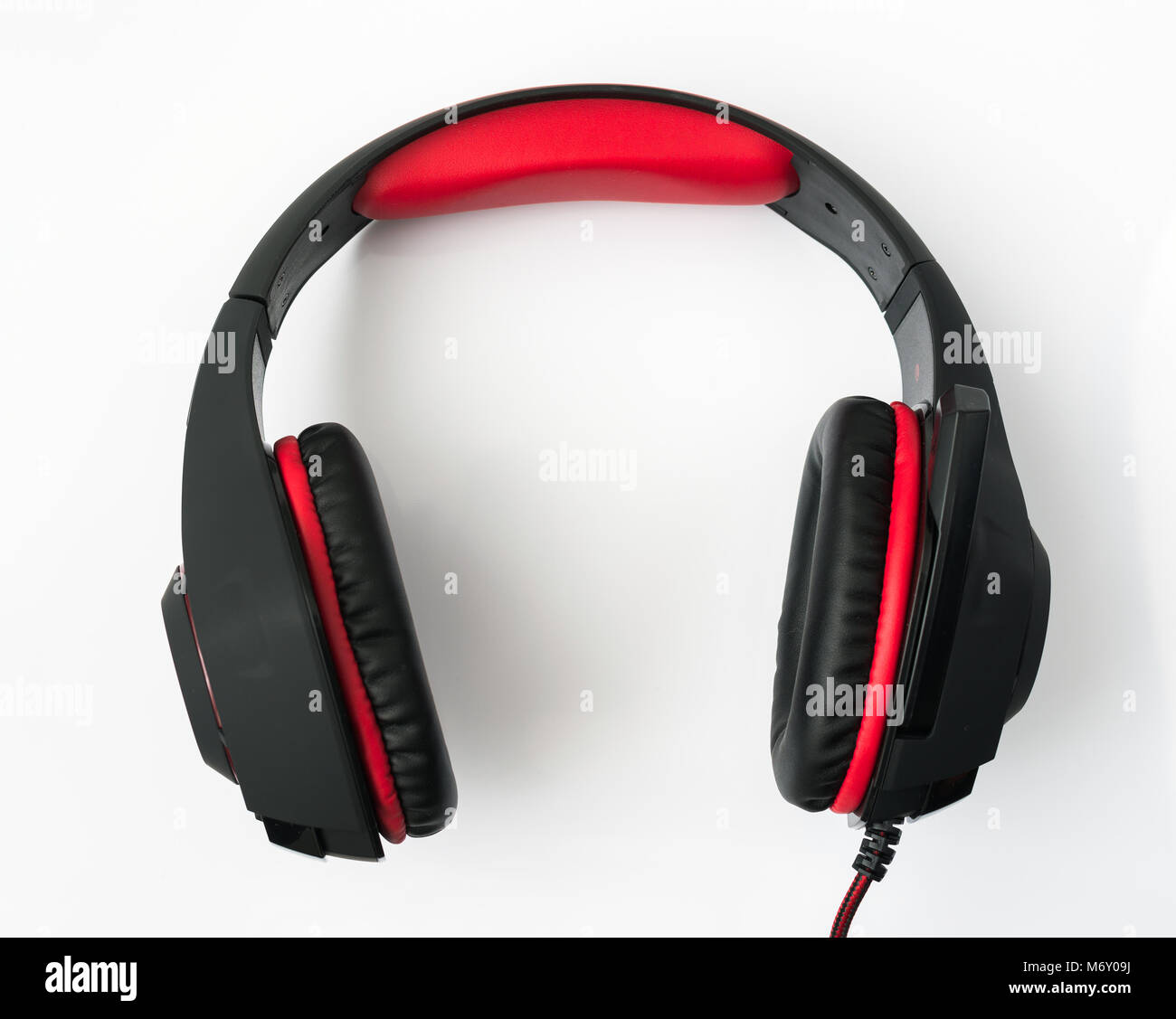black gaming headphones with cord on white background Stock Photo Alamy