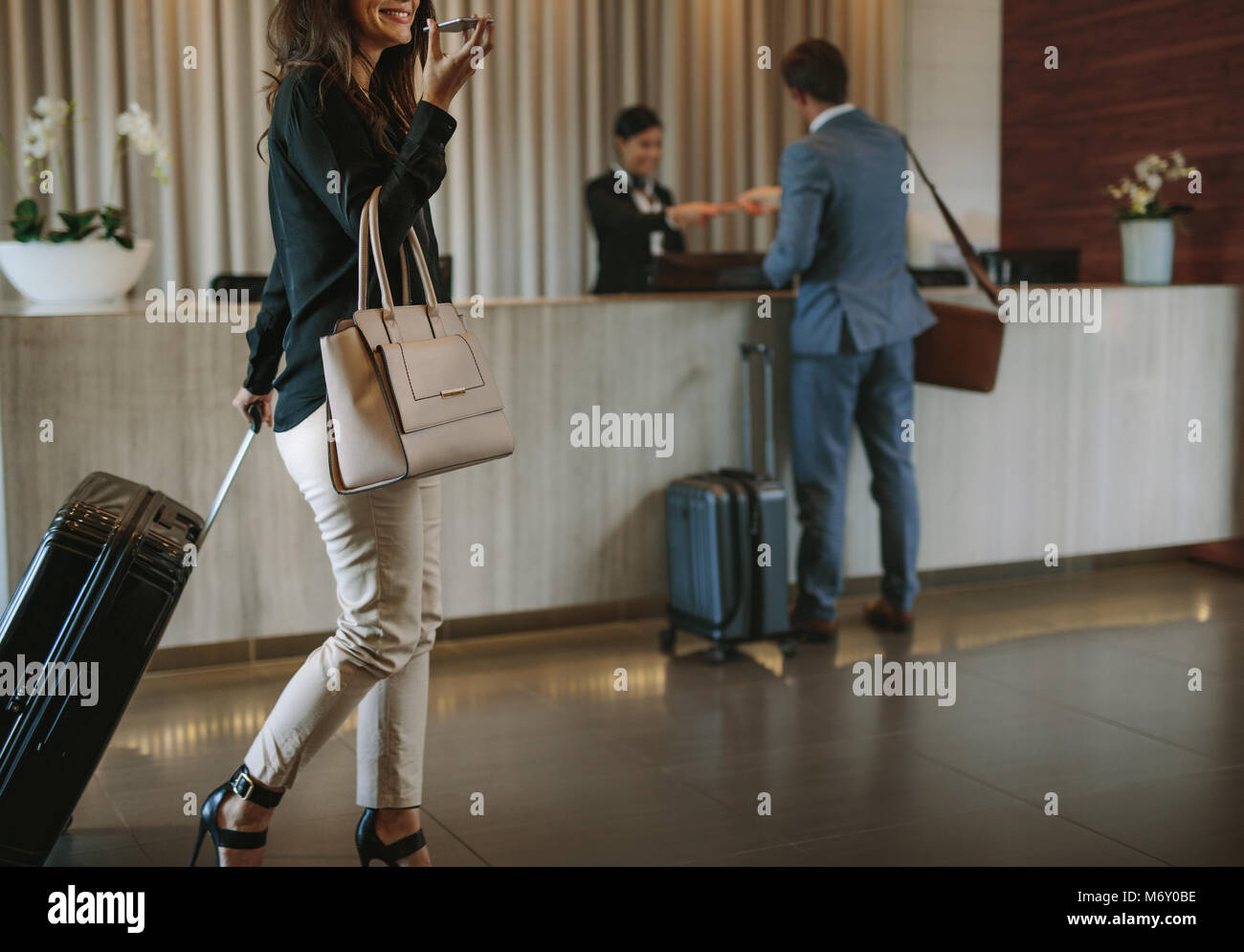 Hotel hallway suitcase hi-res stock photography and images - Alamy