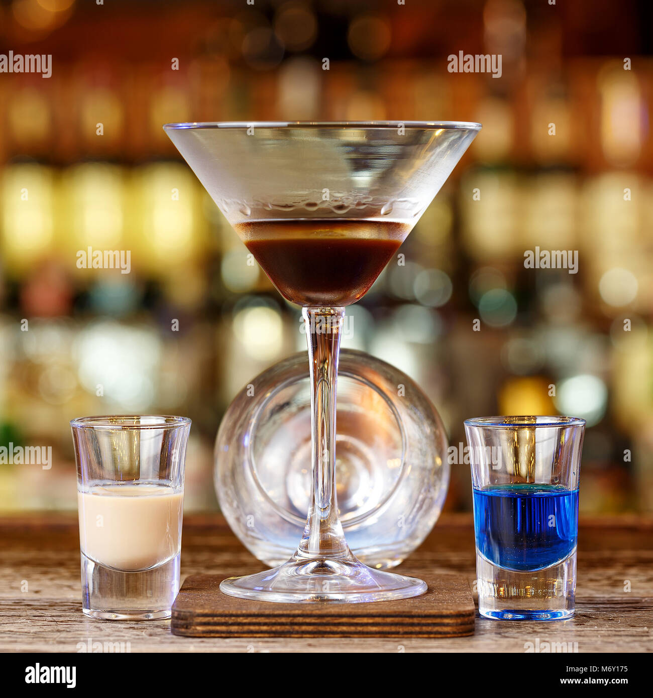 A burning cocktail on the bar, a cocktail based on liqueurs and sambuki. Cocktail party for