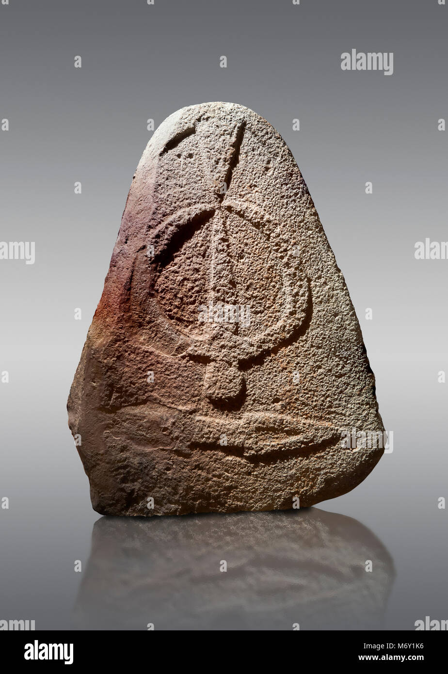 Late European Neolithic prehistoric Menhir standing stone with carvings on its face side. The representation of a stylalised male figure starts at the Stock Photo