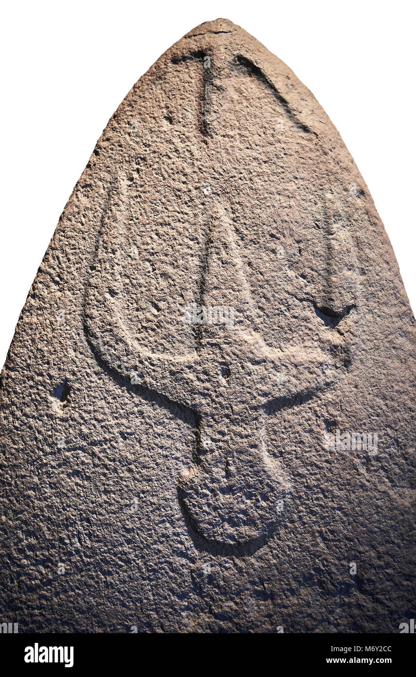 Late European Neolithic prehistoric Menhir standing stone with carvings on its face side. The representation of a stylalised male figure starts at the Stock Photo