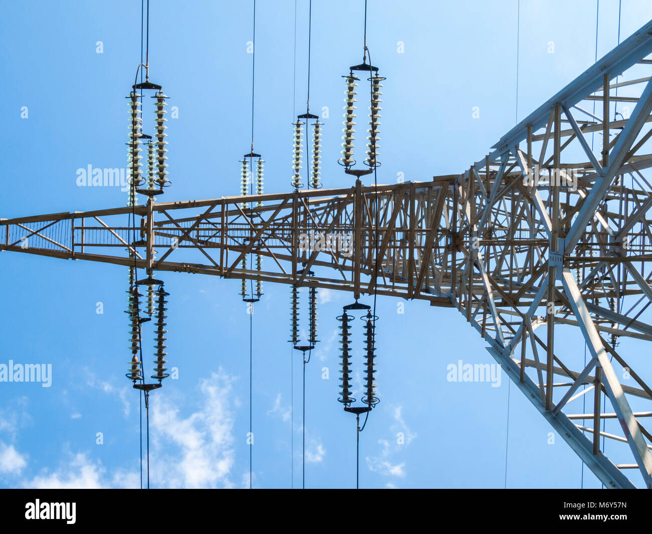 Electricity pillar high voltage line, blue sky Stock Photo - Alamy