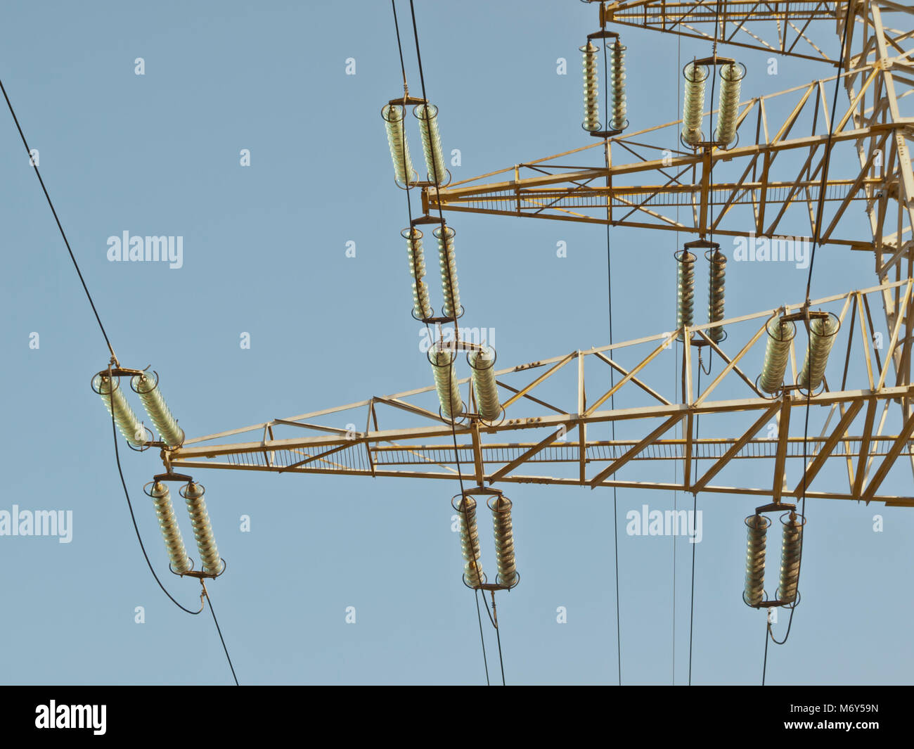 Electricity pillar high voltage line, blue sky Stock Photo - Alamy