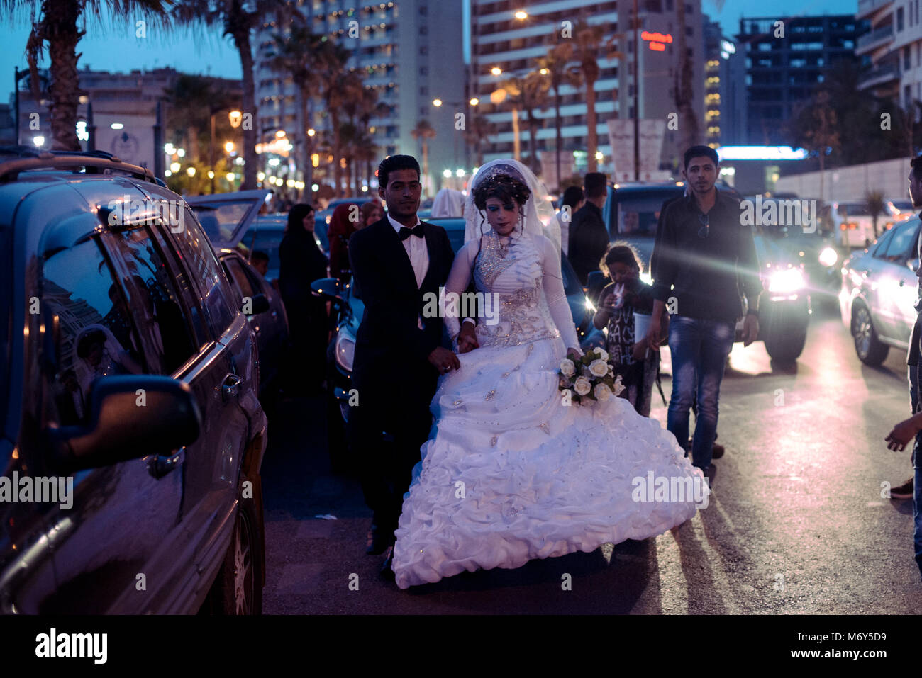 May 14th 2016. A newly married couple walk from their limo next to the the corniche in Beirut