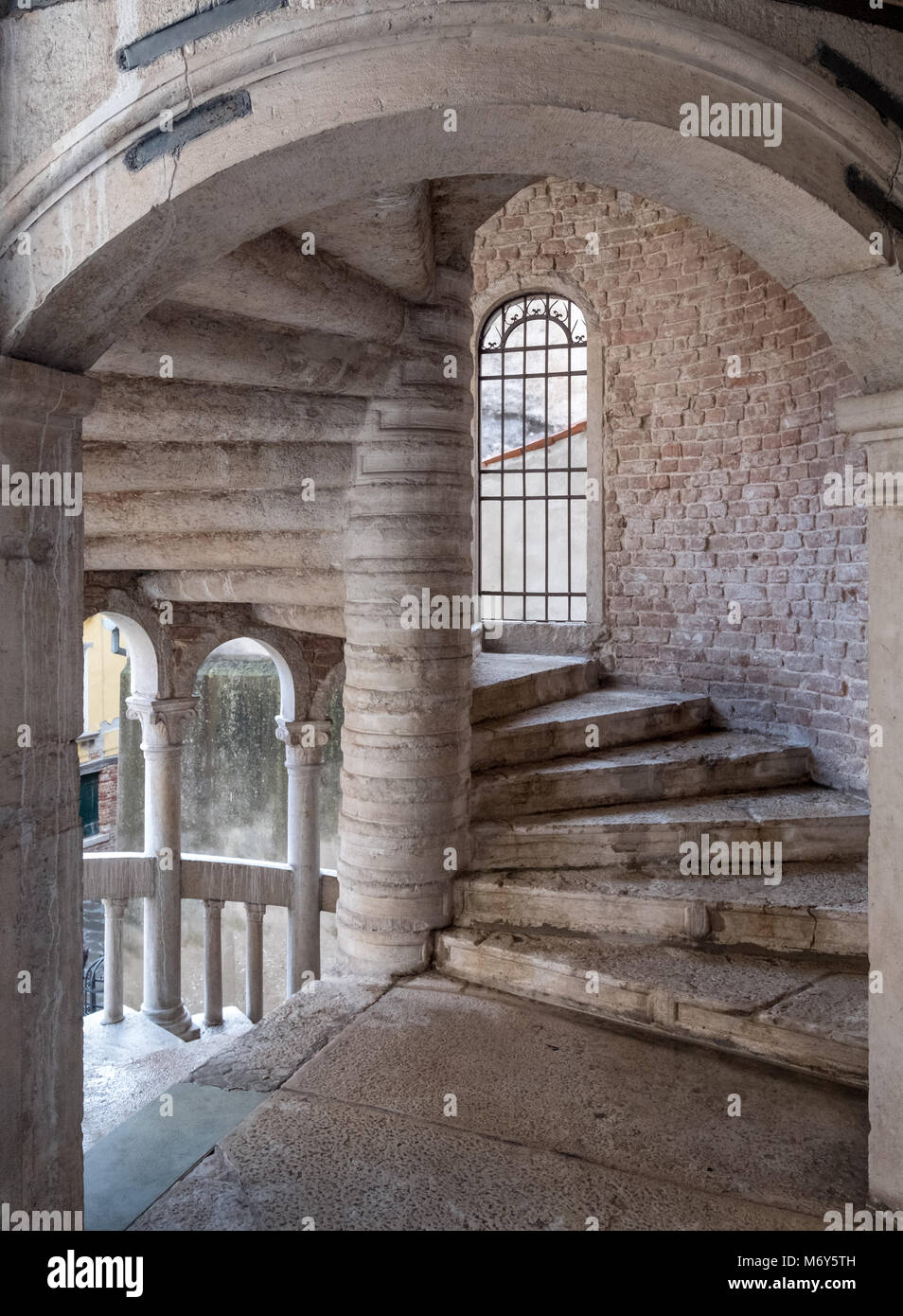 View of the stone spiral staircase structure at Palazzo Contarini del